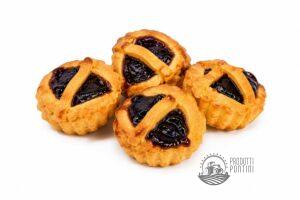 Four jam-filled Danish cookies with lattice tops on a white background.
